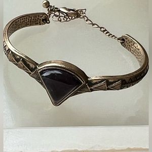 Beautiful Gold Cuff With Adjustable Links. Cone Shape Purple Stone.